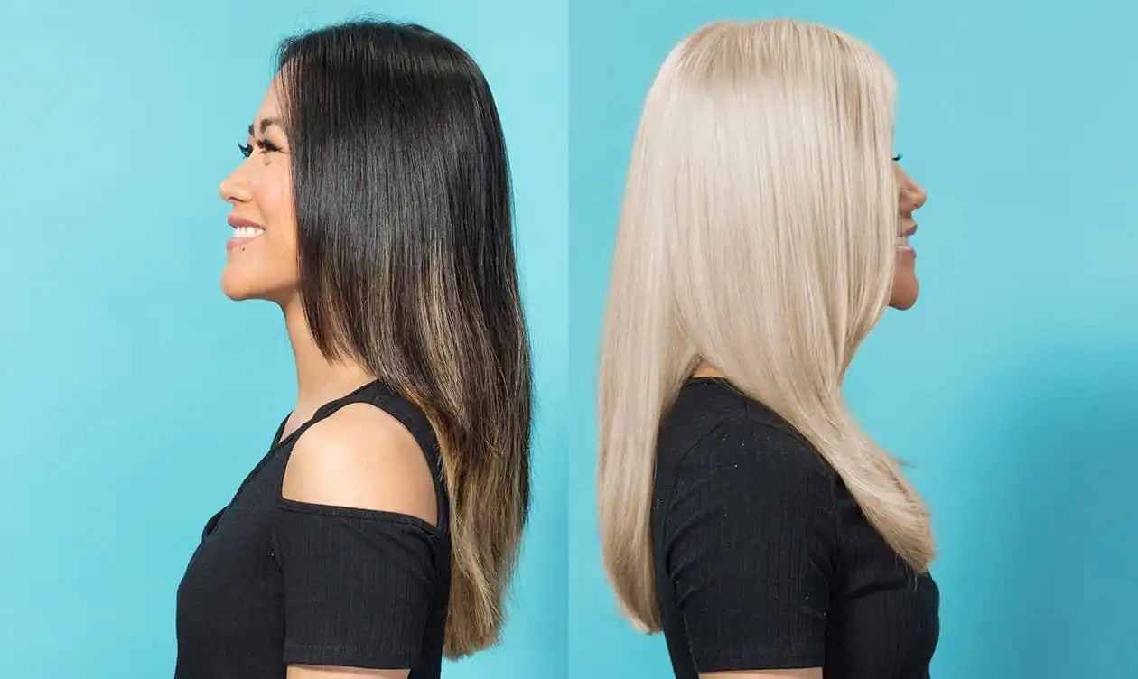 woman with black hair back to back with woman with blonde hair